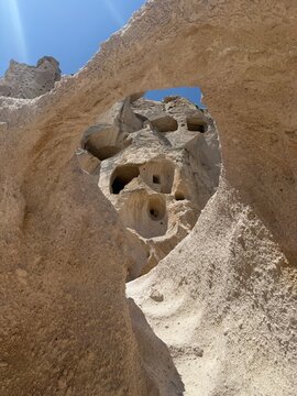 View through rock arch of Cappadocia cave dwellings