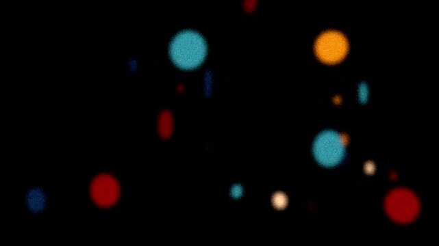 Colorful glowing bokeh loop. Beautiful multi-colored bokeh in retro grainy style flying through the camera. Light ray glowing with soft noise. 80s, 90s Retro futurism. Colorful Neon lights glowing. 