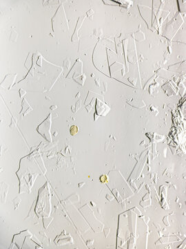 Honey crystals with pollen grains viewed under microscope. Pollen grains appear as yellow spheres amid transparent honey structures