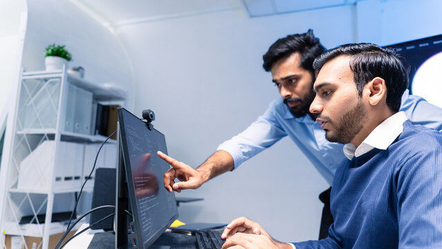 Team engineers software developers are brainstorming and using computer writing code to develop AI technology. Programmer using laptop work system about artificial intelligence and cyber security