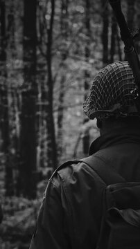 US Army soldiers on a march through European woods during WWII
