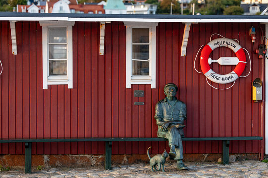 Molle, Sweden  A statue of a fisherman with a cat in the harbour called Ruffagubbe, by Jonas Hogstrom from 2015