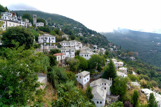 Traditional stone mansions with slate roofs on the green slopes of Mount Pelion in Greece