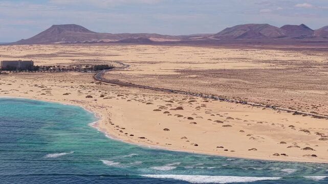 Aerial views of Corralejo town on the northeast coast of Fuerteventura, Canary Islands of Spain. It's known for Corralejo Natural Park, featuring windy, dune-backed beaches like Playa del Moro.