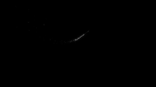 Twinkling glitter stars and sparkling fairy dust trail with glowing light bursts, white shimmer particles and magical doodle effects creating a fantasy sparkle on black screen background, 4K