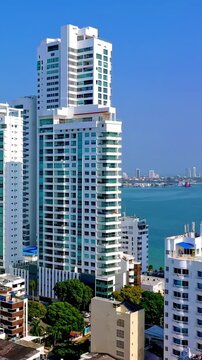 Aerial view of modern white skyscrapers in Cartagena, Colombia, overlooking the Caribbean Sea
