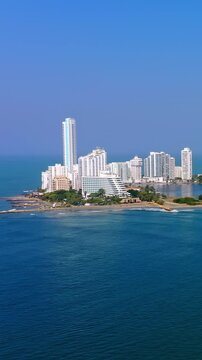 Aerial view of the Bocagrande skyline in Cartagena, Colombia, featuring modern skyscrapers along the Caribbean Sea coastline