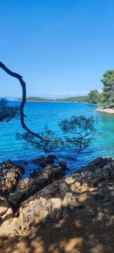 Scenic Adriatic Coast in Malinska, Krk Island, Croatia, with Turquoise Sea and Mountains