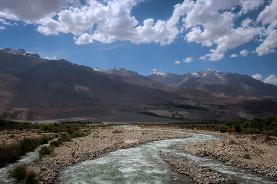 Scenic road view and Tajik-Afghan border along Panj River near Khorog town, Tajikistan