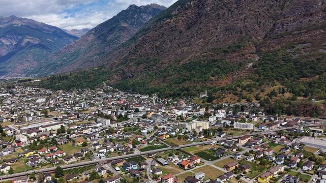 A panoramic aerial view beside the old town of the city Biasca in Switzerland on a sunny summer noon.