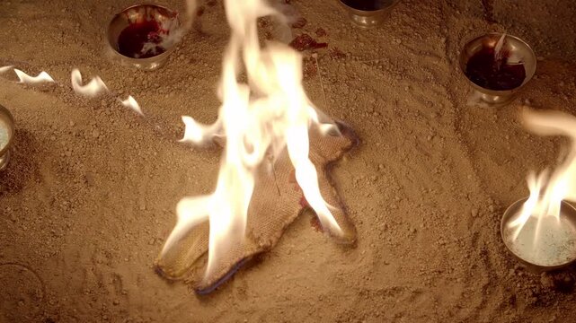 A voodoo doll on fire in an acient ritual. (recorded at 60 fps, you have to speed up x2 for real time)
