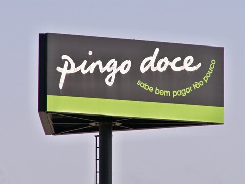 Pingo Doce supermarket billboard standing tall against a clear sky