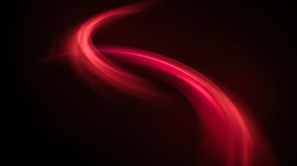 Fototapeta premium Abstract red light streaks forming a curved shape against a solid black background with background soft glowing