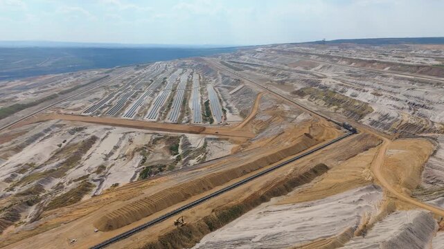 Hambach open pit mine operation area, mining lignite and solar panel photovoltaic modules, change to renewable sustainable energy