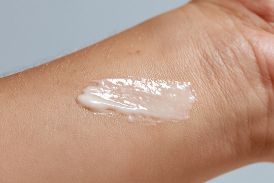 Gentle skin barrier moisturizer cream on arm macro