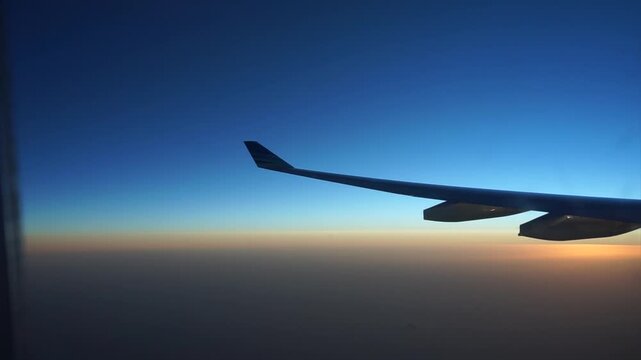 Aircraft Wing Sunset Horizon View From Passenger Window High Altitude Flight Travel Concept Commercial Jet Aviation Scenic Twilight Background Quiet Journey Vacation Sky Destination