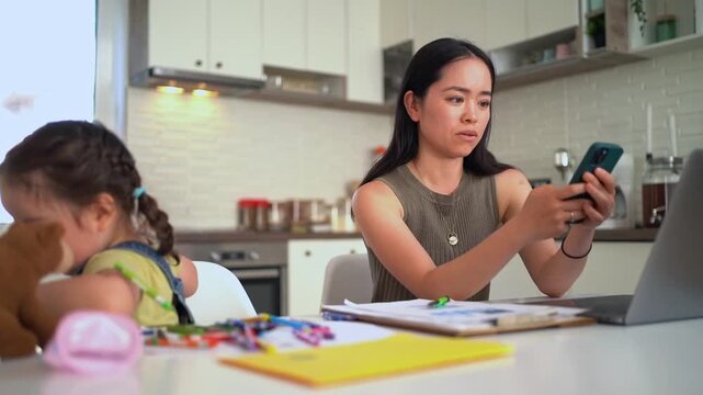 Stressed mother working from home having a phone argument