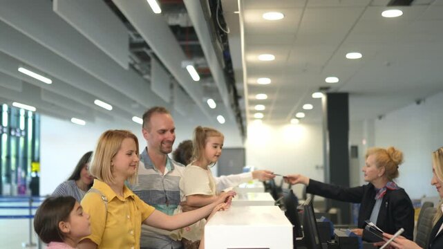 Happy family is checking in at an airport check-in counter