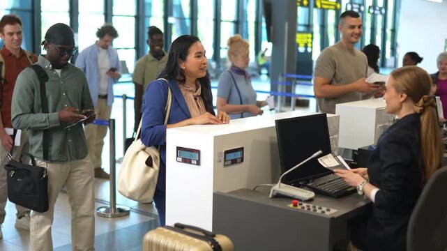 Asian businesswoman passing passport control at the airport check-in desk