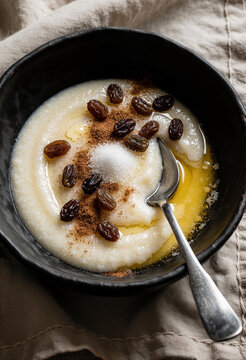 Creamy Semolina Porridge with Raisins, Cinnamon, Sugar and Melted Butter