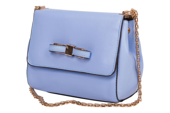 Light blue leather womens crossbody bag with gold chain strap isolated on white background. Small bow handbag side view