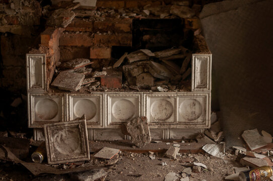 Abandoned overgrown mansion with spiral staircase, old car and ruined interior