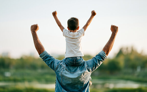 Dad and son outdoors. Happy family