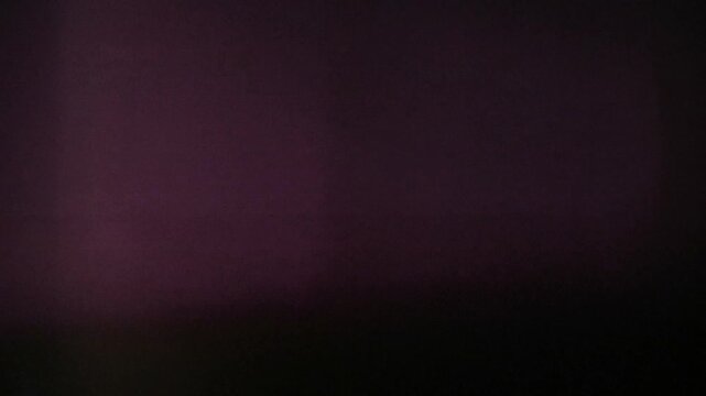 Dark violet abstract blurry texture suitable for modern design projects, web backgrounds, graphic overlays, digital art creations, and video editing.