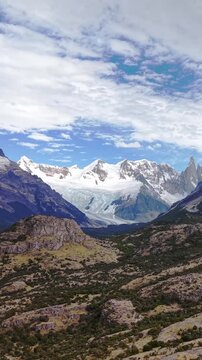 Stunning panoramic view of snow capped mountains and glacier in Patagonia Argentina