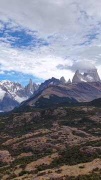 Scenic view of the Andes mountains in Patagonia, Argentina, with snow-capped peaks and dramatic clouds