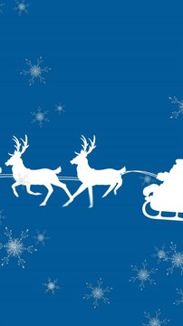 Animation of santa claus in sleigh with reindeer over snow falling on blue background