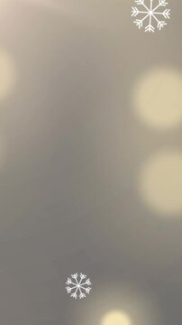 Digital animation of snowflakes falling against spots of light on yellow background