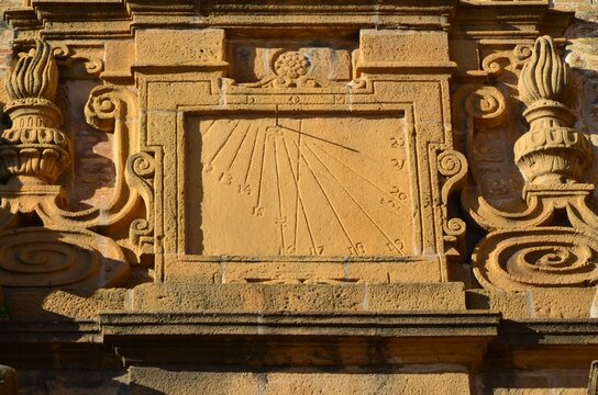 Vertical sundial carved in sandstone on the facade of the Church of San Rocco