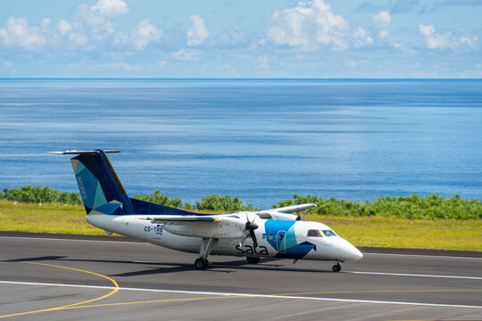 FAIAL, AZORES, PORTUGAL - JULY 19, 2026: A SATA Air Acores De Havilland Canada Dash 8 regional turboprop aircraft, registration CS-TRB, taxis on the runway at Faial Airport near the Atlantic Ocean