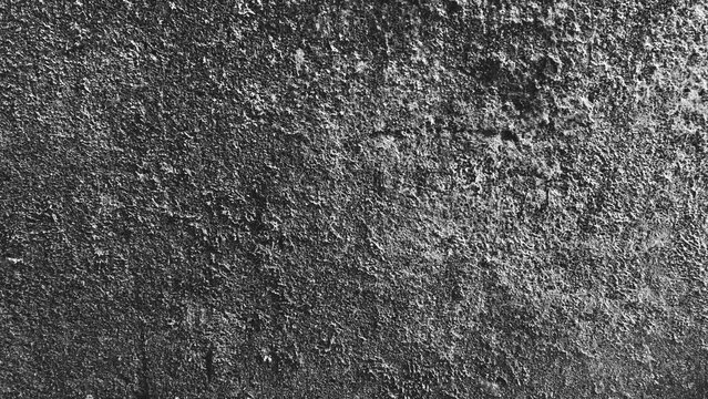 High contrast black and white grunge texture featuring heavily weathered concrete, irregular stains and distressed patches, ideal for dramatic backgrounds and artwork.