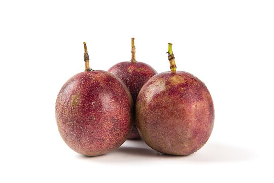 whole ripe passion fruits isolated on white background