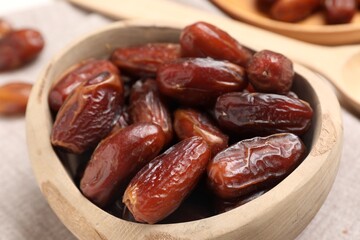 Fototapeta premium Tasty dried dates in bowl on table, closeup
