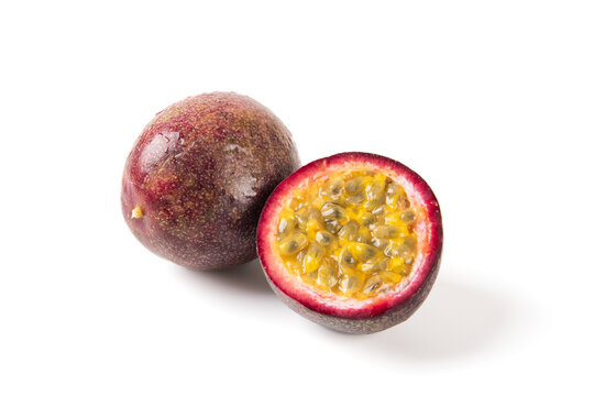 Whole and cut passion fruit isolated on white background