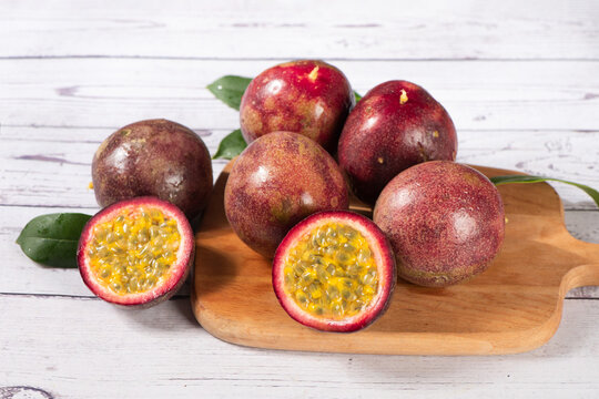 fresh ripe passion fruits on wooden table