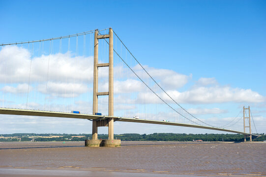 Side view of cars driving across the Humber Bridge over the Humber Estuary, Humberside, England, UK