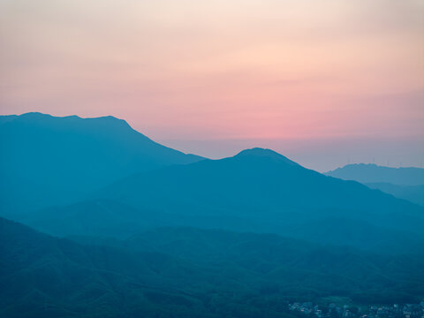 Baihua Mountain in Guigang Guangxi at dusk with layered ridges and soft twilight hues
