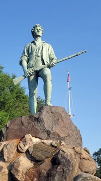Minute Man Statue and American Flag. Lexington MA
