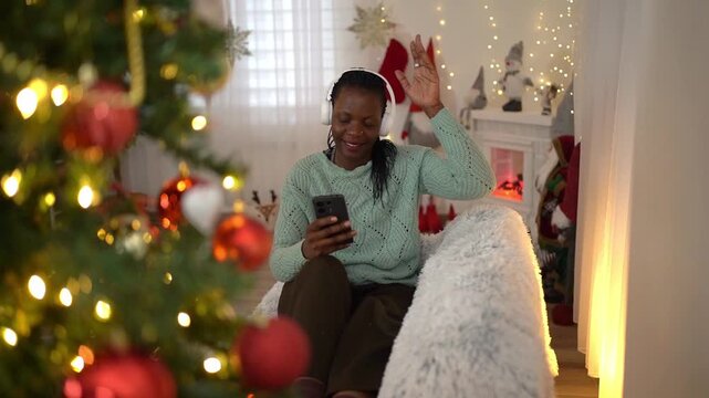 African American woman having a video call during Christmas time