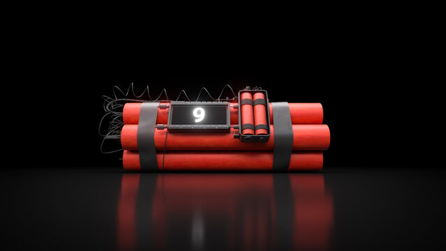 Red dynamite sticks tied with black straps, featuring a digital timer, wires and electronic detonator on a black surface.