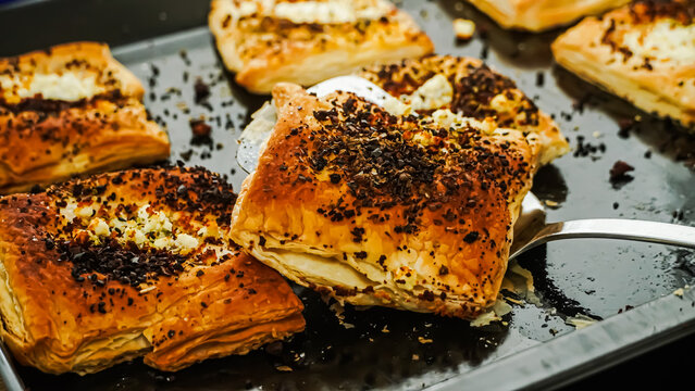 Freshly Baked Savory Puff Pastry Squares with Cheese and Herbs
