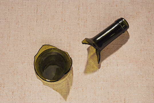 neck and bottom of a broken  wine bottle