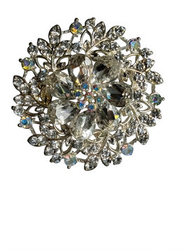 Sparkling crystal round brooch with intricate metal design isolated on transparent background, isolated on white background