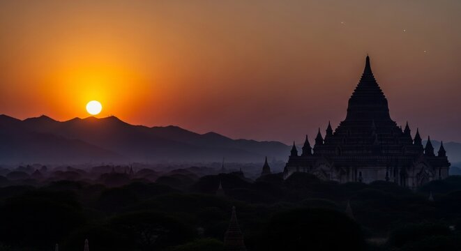 Breathtaking sunset over a valley of ancient temples with a transitioning sky and faint stars