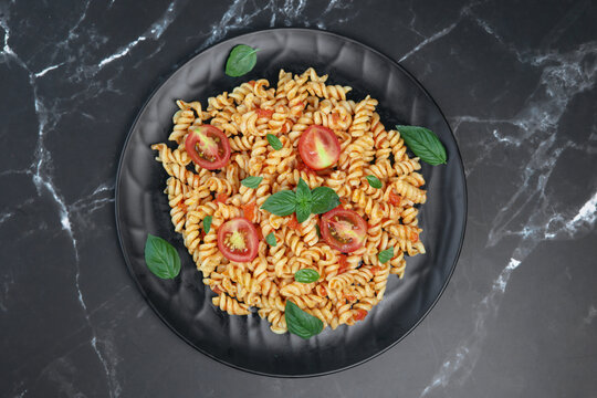 fusilli pasta with tomato sauce and basil