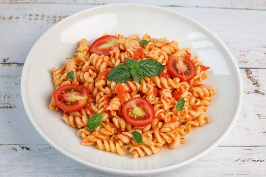fusilli pasta with tomato sauce and basil